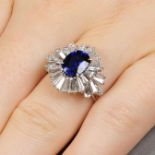 A sapphire and tapered baguette-cut diamond dress ring.Sapphire calculated weight 2.42cts,