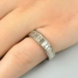 A baguette-cut diamond full eternity ring.