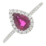 An 18ct gold ruby and brilliant-cut diamond cluster ring.Ruby weight 0.79ct,