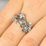 A brilliant-cut diamond collet dress ring.