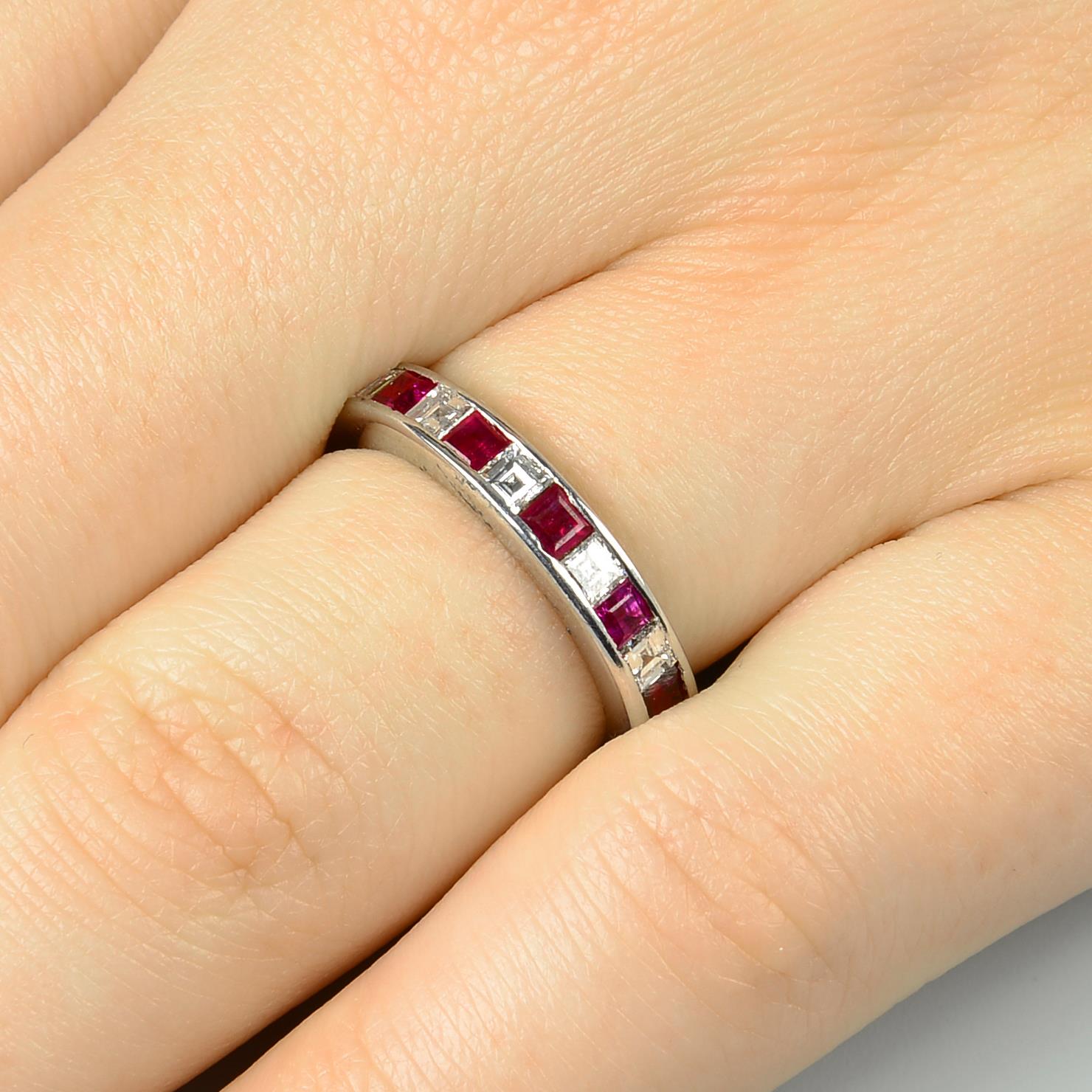 A square-shape ruby and diamond full eternity ring.