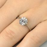 A mid 20th century oval old-cut diamond single-stone ring, with diamond accent gallery.