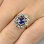 A sapphire and diamond cluster ring.Sapphire calculated weight 1.16cts,