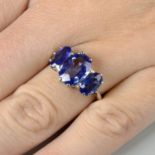 A graduated oval-shape Sri Lankan sapphire three-stone ring.