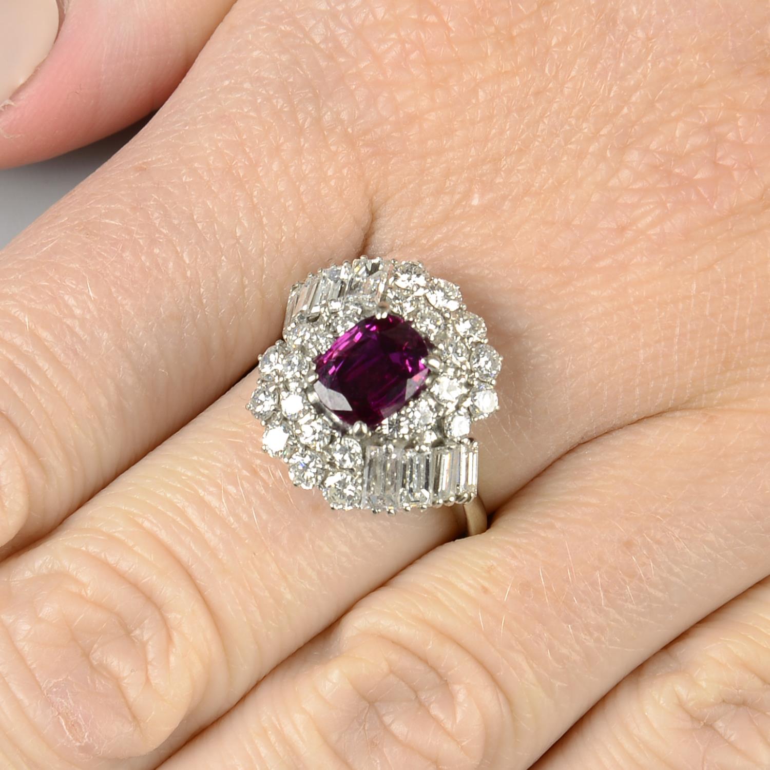 A ruby and vari-cut diamond dress ring.Ruby calculated weight 1.52cts,