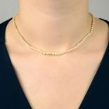 A natural pearl single-strand necklace,