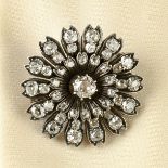 A late Victorian silver and gold old-cut diamond floral brooch.Estimated total diamond weight
