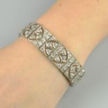 An Art Deco platinum circular-cut diamond openwork bracelet.Estimated total diamond weight 11cts,