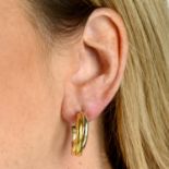 A pair of 'Trinity' hoop earrings, by Cartier.