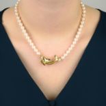 A cultured pearl single-strand necklace, with dolphin highlight, by Cartier.Stamped 750.