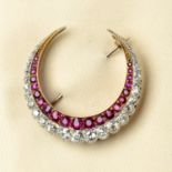 A late Victorian gold and silver, ruby and old-cut diamond crescent brooch.