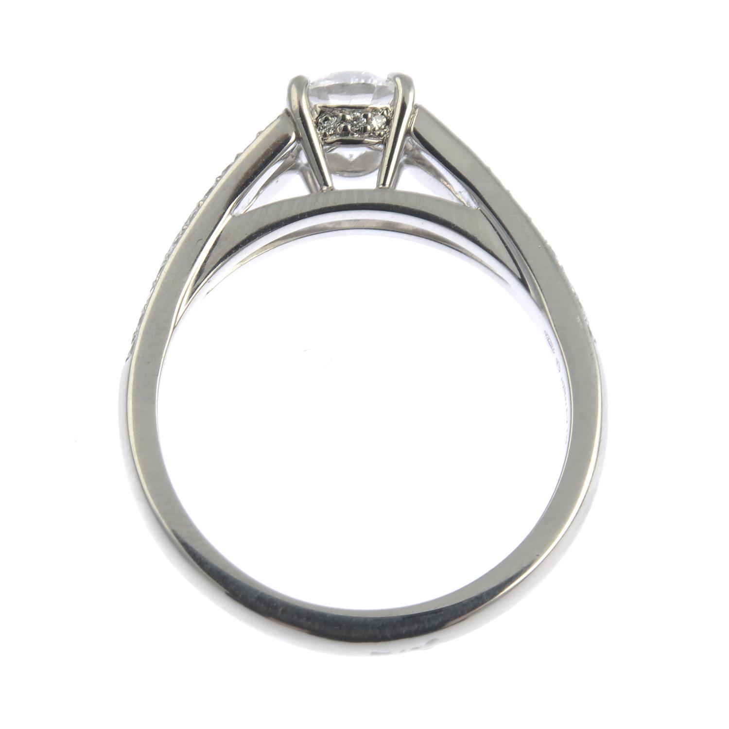 A platinum brilliant-cut diamond single-stone ring, with diamond chevron shoulders. - Image 2 of 6