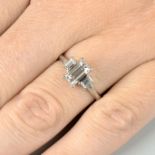 A baguette-cut diamond three-stone ring.