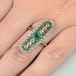 An emerald and diamond dress ring.