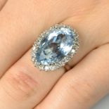 An aquamarine and diamond cluster ring.Aquamarine calculated weight 7.48cts,