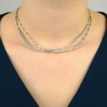 A brilliant-cut diamond crossed swag necklace,