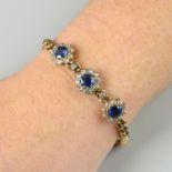 An early 20th century 9ct gold sapphire and diamond cluster bracelet.