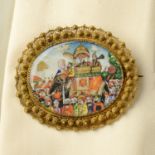 An early 20th century gold miniature brooch, painted to depict a wedding procession.Length 5.7cms.