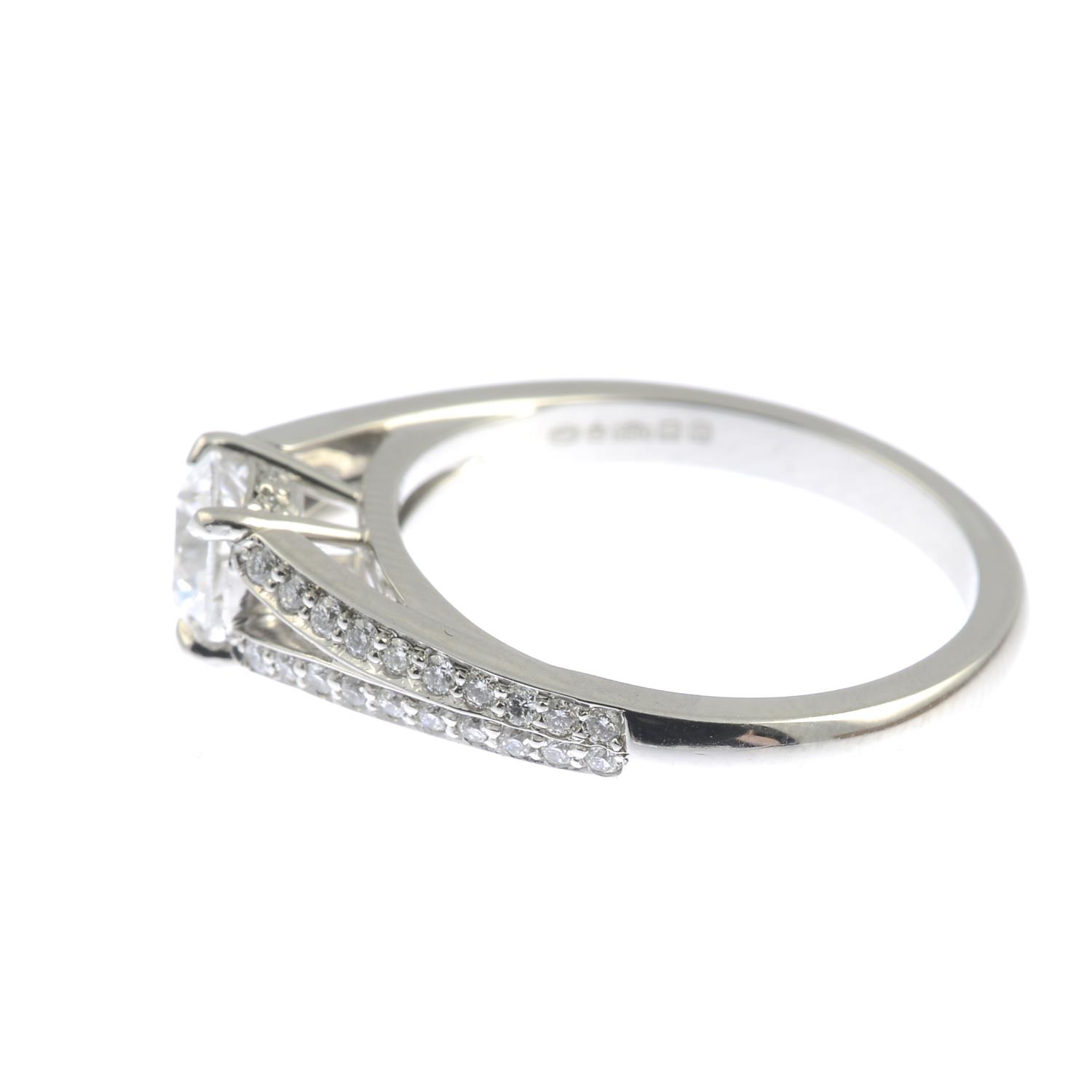 A platinum brilliant-cut diamond single-stone ring, with diamond chevron shoulders. - Image 5 of 6