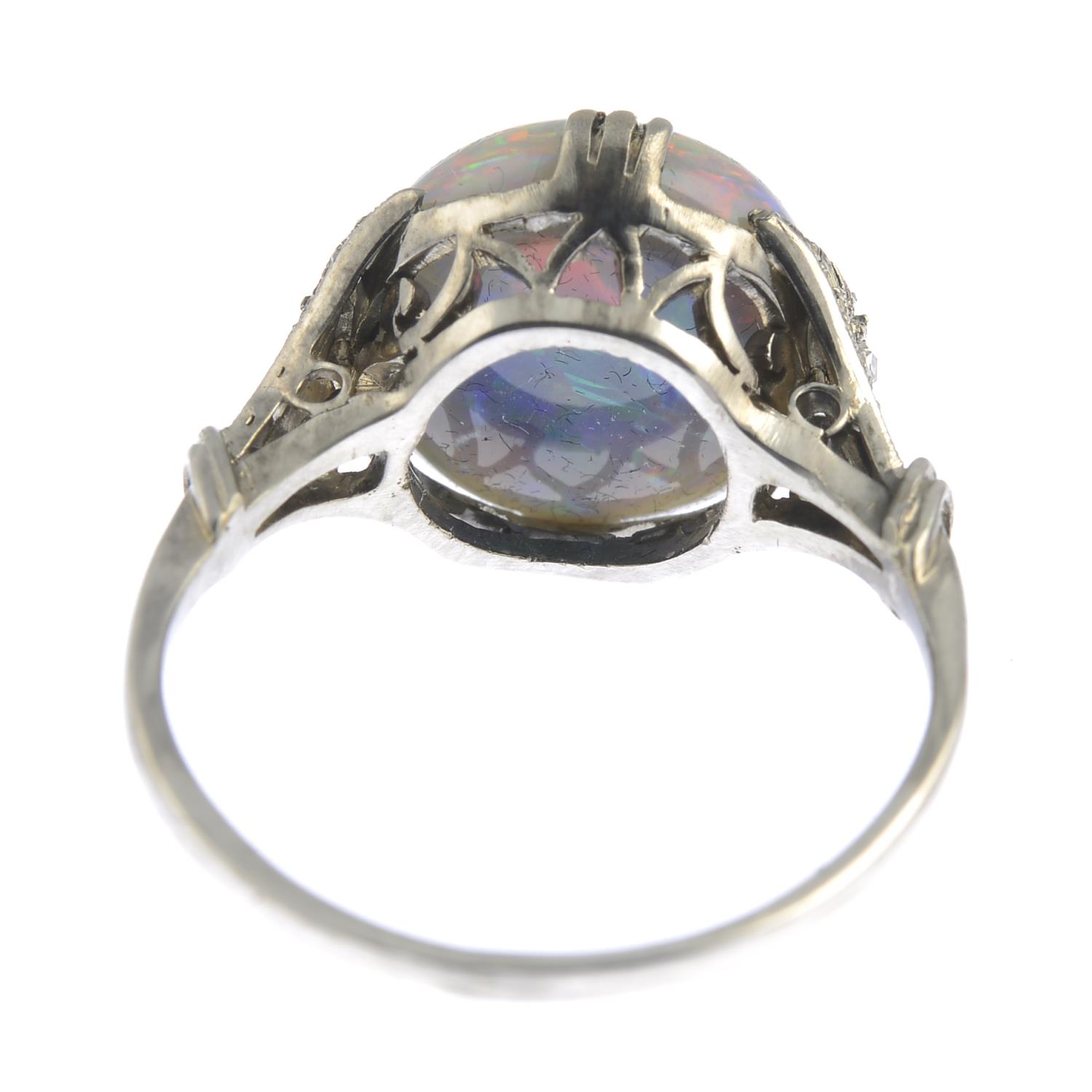 A black opal and rose-cut diamond accent ring.Opal weight 4.61cts.Ring size M. - Image 4 of 6