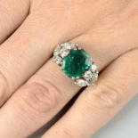 A Colombian emerald and diamond dress ring.