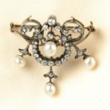An early 20th century silver and gold, cultured pearl and diamond brooch.