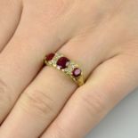 A late Victorian 18ct gold ruby three-stone ring, with diamond spacers.