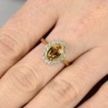 A yellow topaz and diamond cluster ring.