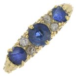 An 18ct gold Edwardian sapphire and diamond three-stone ring.Hallmarks for London,