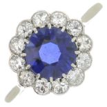 A synthetic sapphire and diamond cluster ring.Estimated total diamond weight 0.50ct.Ring size O1/2.