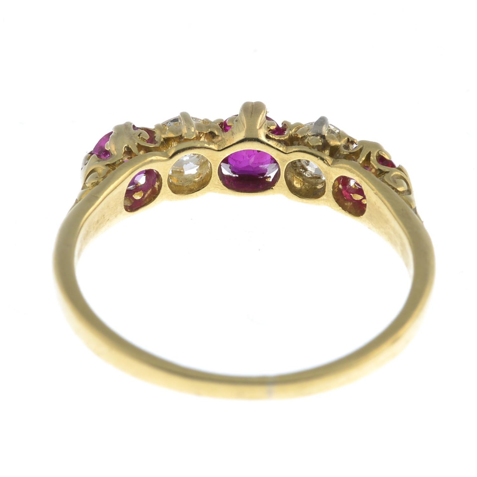 A ruby and diamond five-stone ring.Estimated total diamond weight 0.10ct.Stamped 18ct.Ring size K. - Image 3 of 3