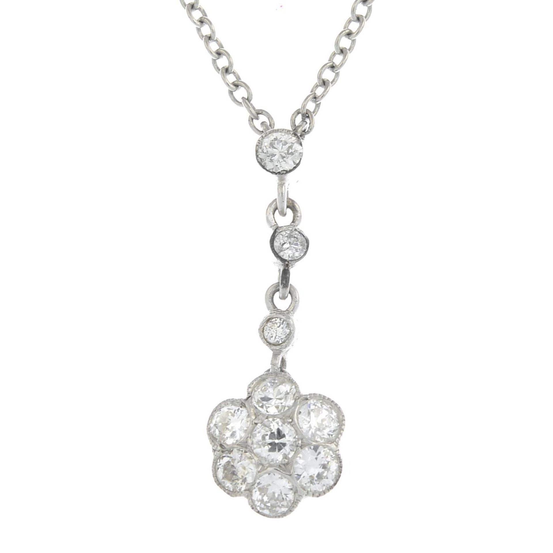 A diamond floral pendant,