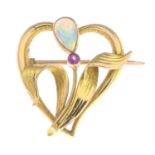 An Art Nouveau 15ct gold opal and ruby brooch.Stamped 15ct.Length 2.1cms.