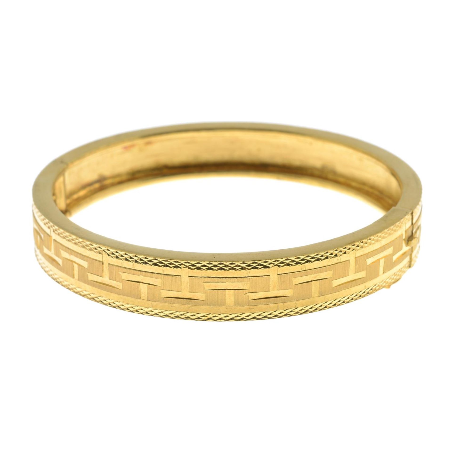 A hinged bangle.Oriental marks to indicate high carat gold.Inner diameter 5.3cms. - Image 2 of 2