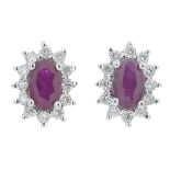 A pair of ruby and diamond cluster earrings.Total diamond weight 0.18ct,