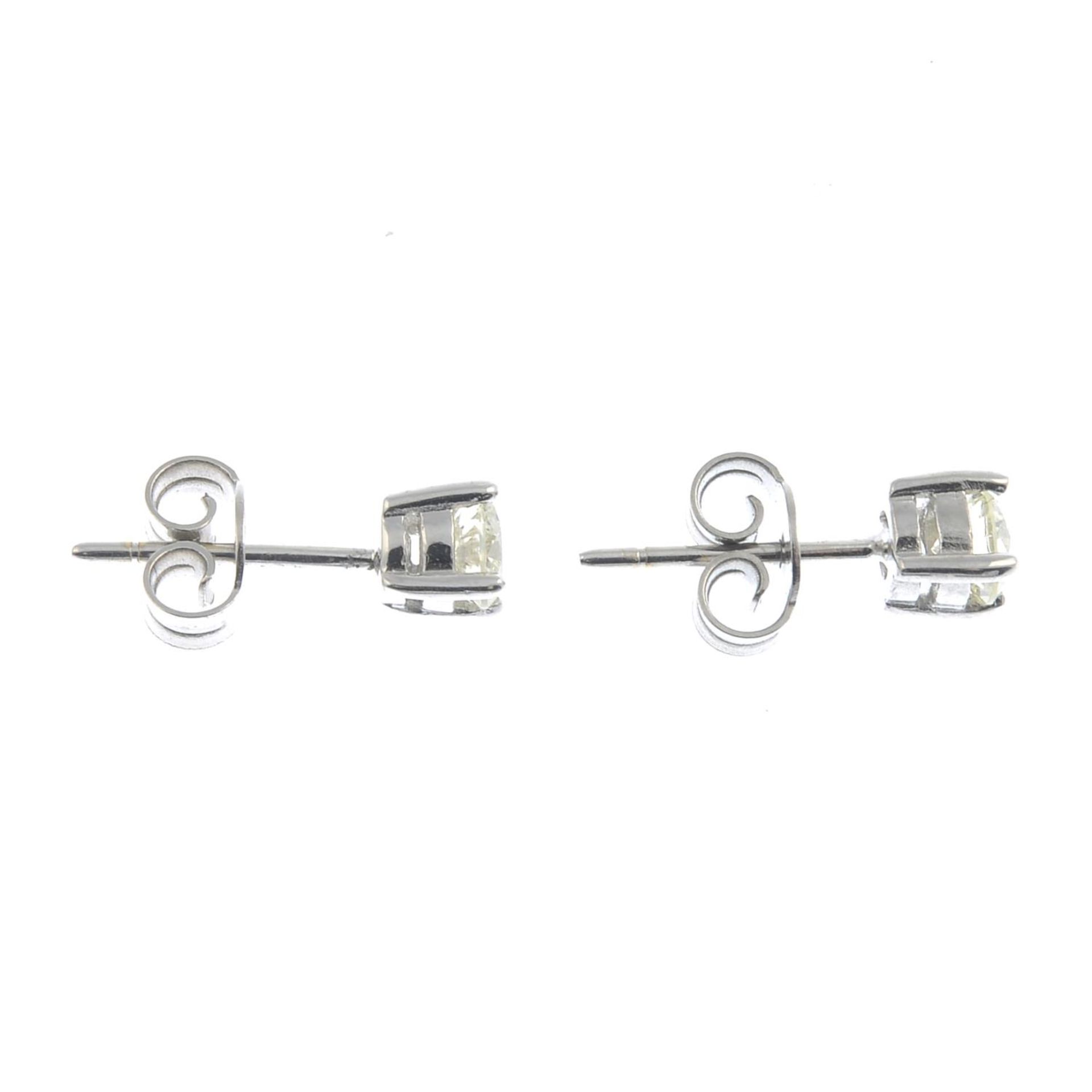 A pair of brilliant-cut diamond earrings.Estimated total diamond weight 0.65ct, - Image 2 of 2