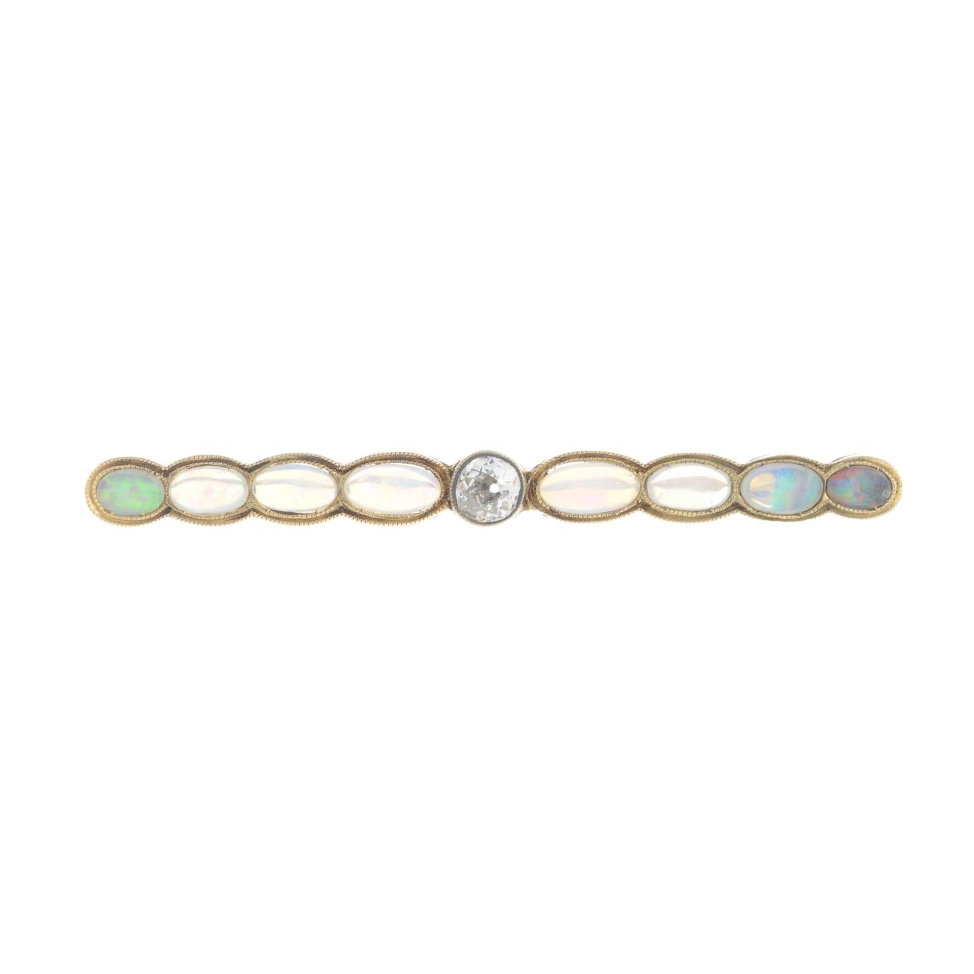 An early 20th century gold opal and diamond bar brooch.