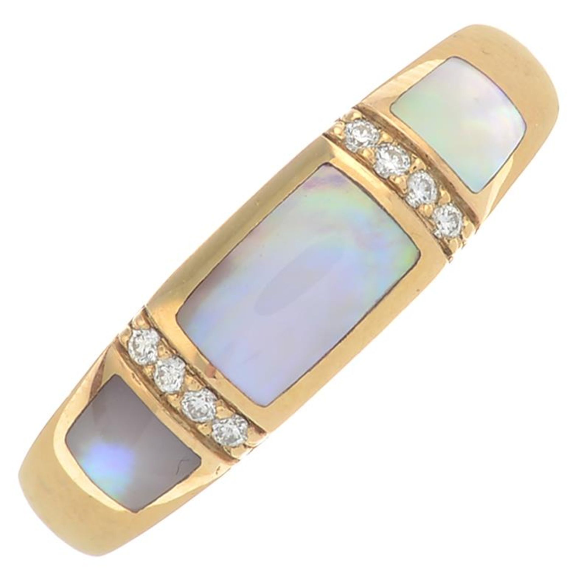 An 18ct gold mother-of-pearl and diamond dress ring.Signed Kabana.Hallmarks for Sheffield.