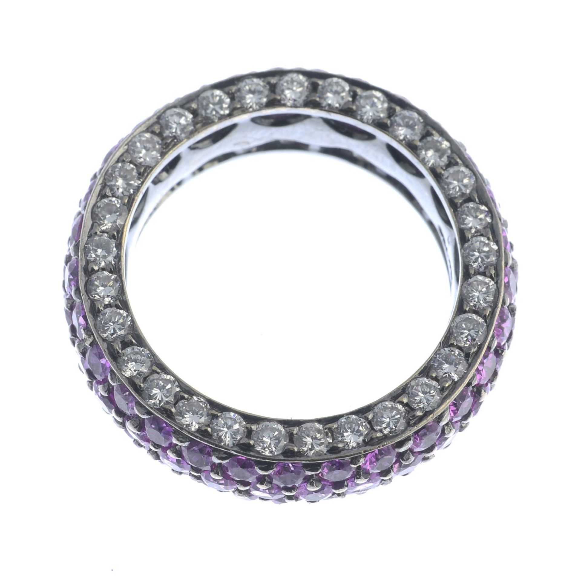 A pink sapphire and diamond band ring.Estimated total diamond weight 1.20cts.Stamped 750.Ring size - Image 3 of 3