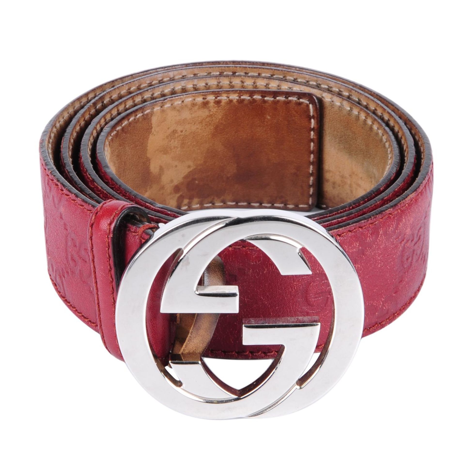 GUCCI - a red Guccissima belt.