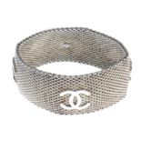 CHANEL - a silver mesh bracelet.