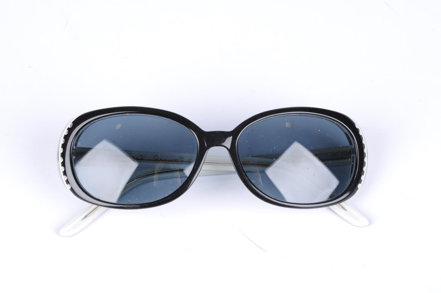LULU GUINNESS - a pair of polarized sunglasses.