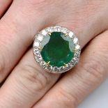 An emerald and brilliant-cut diamond cluster ring.