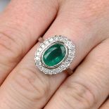 An emerald and brilliant-cut diamond cluster ring.Emerald calculated weight 1.82cts,