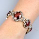 An Edwardian silver and gold, pink tourmaline and rose-cut diamond cluster bracelet.