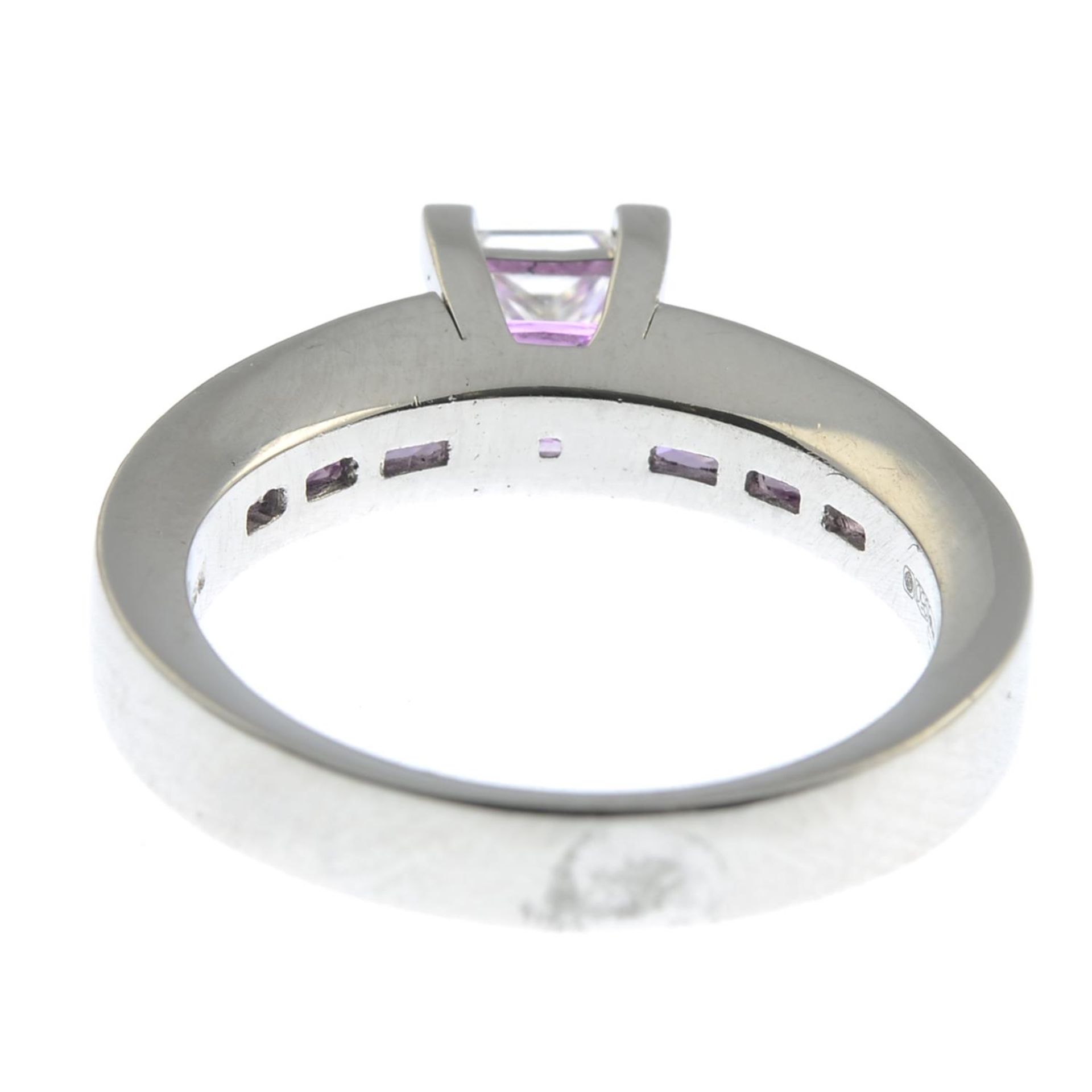 A platinum diamond single-stone ring, with square-shape pink sapphire line gallery and shoulders. - Image 2 of 5