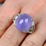 A star sapphire cabochon ring, with vari-cut diamond shoulders.