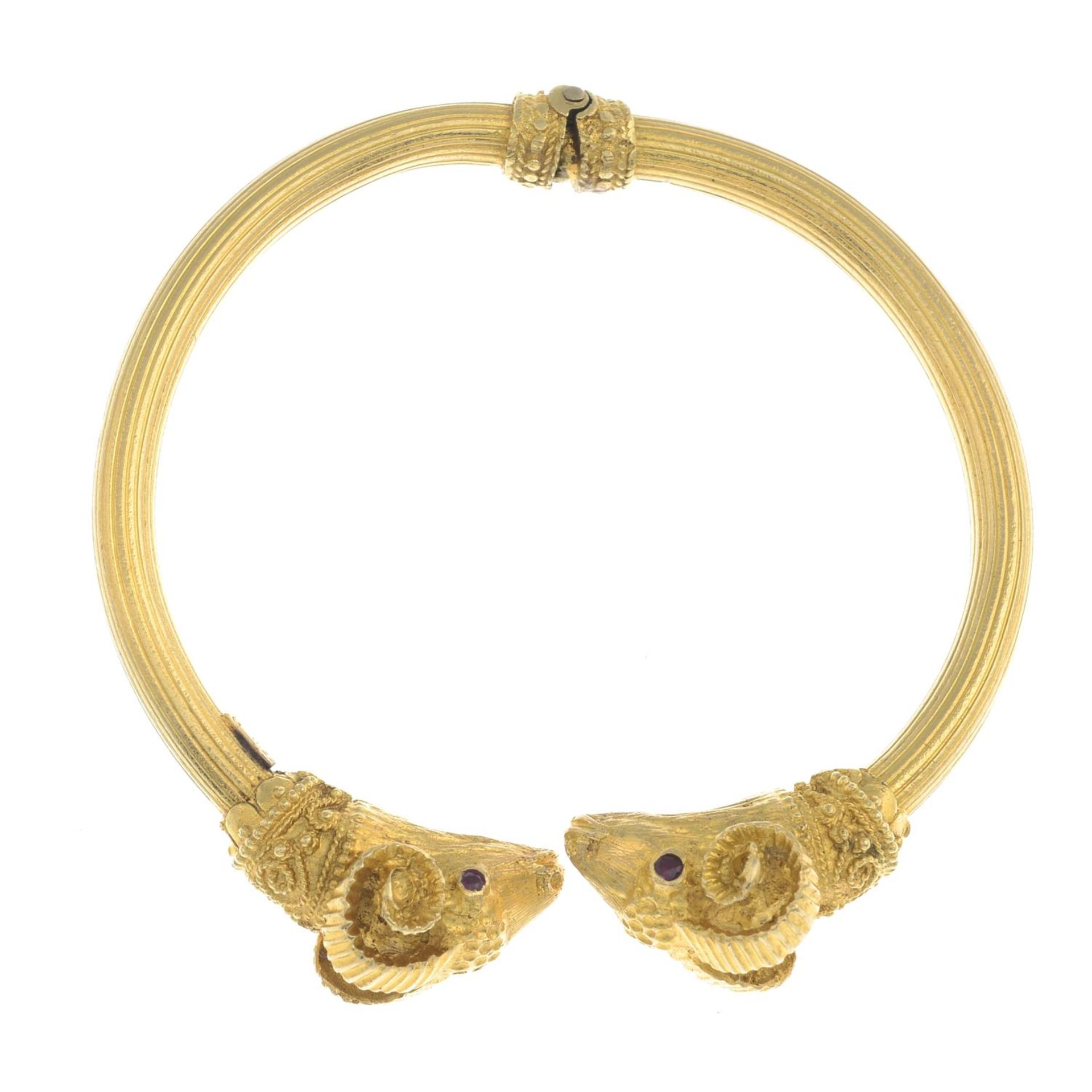 A ram's head hinged bangle, with ruby eyes, by Ilias Lalaounis.Stamped 750. - Image 4 of 5