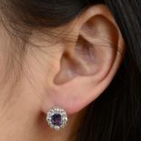A pair of sapphire and brilliant-cut diamond cluster earrings.Sapphire calculated total weight