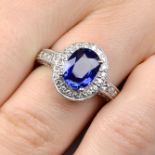 An 18ct gold oval-shape sapphire and brilliant-cut diamond dress ring.Sapphire weight 2.80cts,